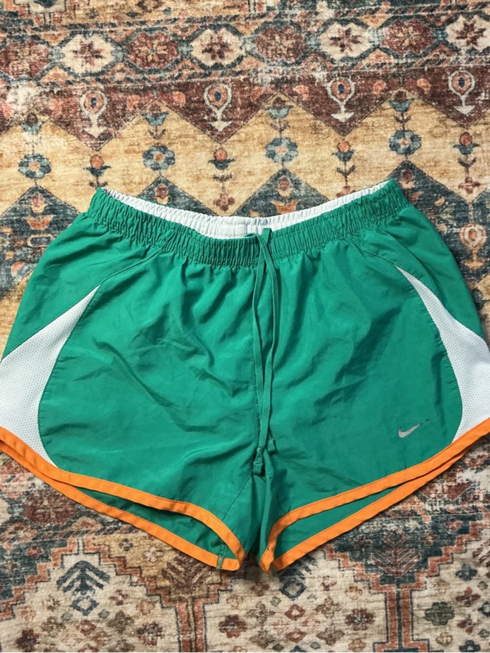 Nike Women’s Green Athletic Shorts with Orange Trim